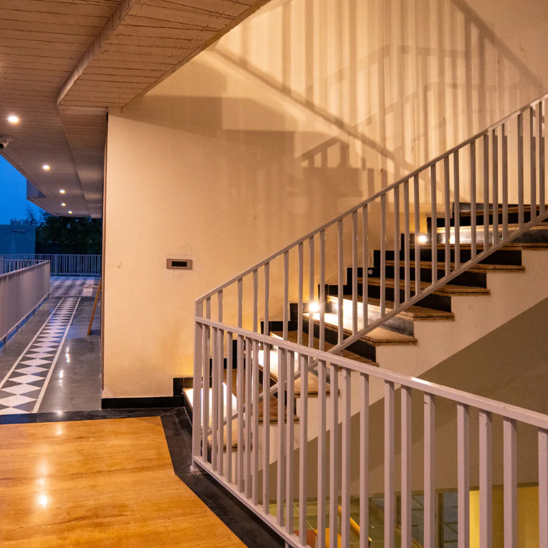 Illuminated Staircase at Villa Miraan – Large Group Villa with Pool Udaipur Modern indoor staircase with step lighting at a large group villa with pool Udaipur.