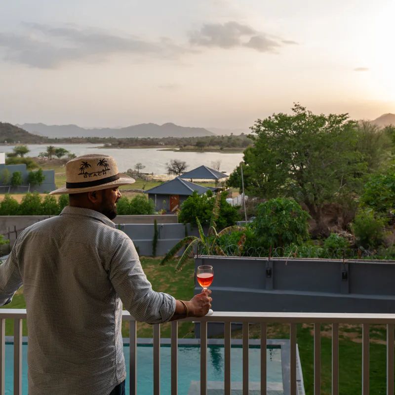 villa-miraan-udaipur-private-balcony-lake-lakhawali Private balcony with pool and lake view at Villa Miraan Udaipur